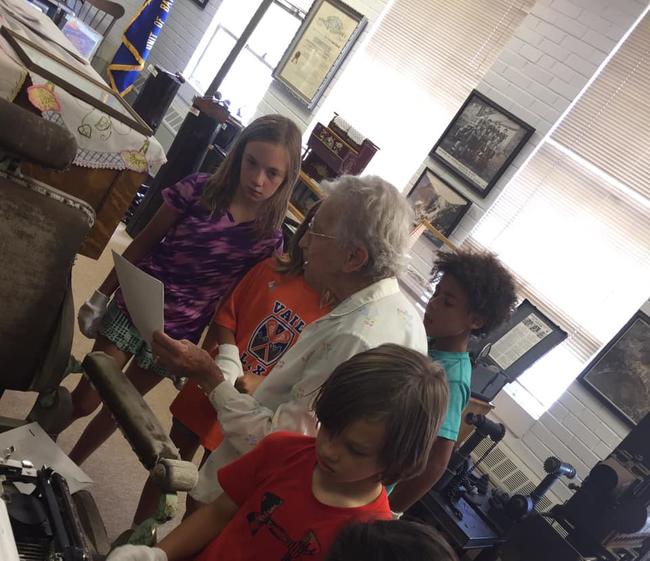 Mrs Beck teaching kids in the museum